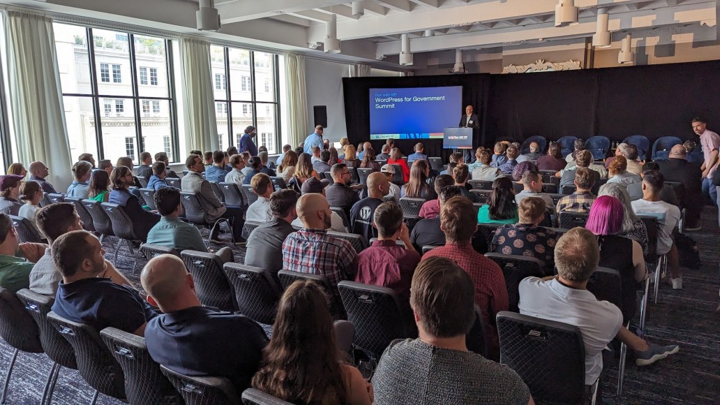 Group of people watching a presentation 