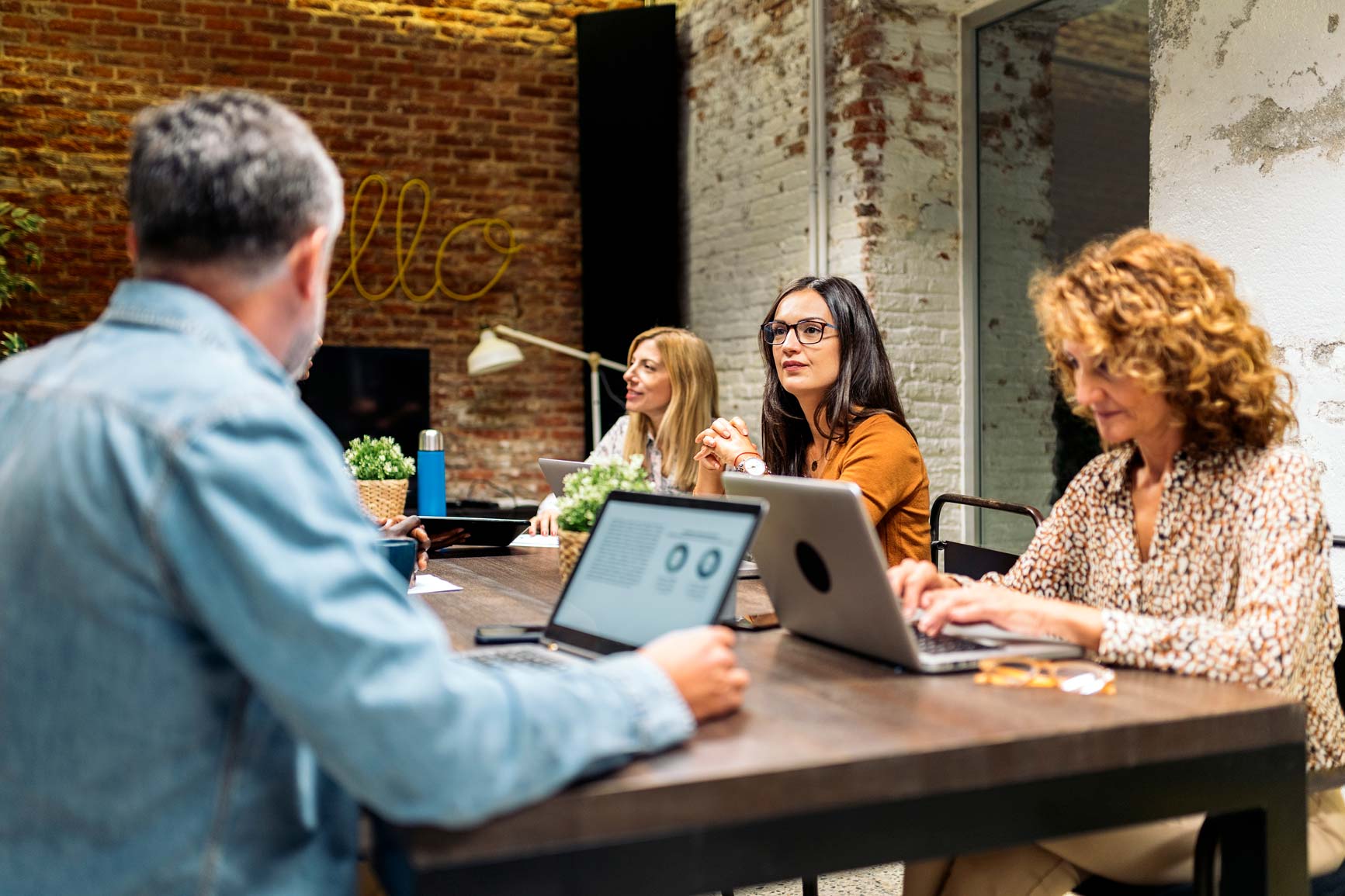 People working around a desk